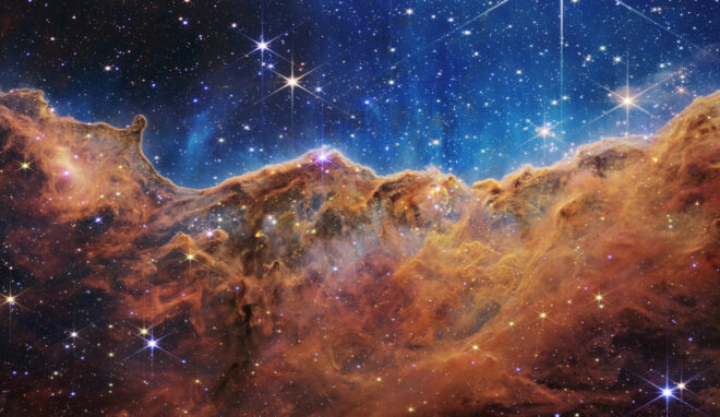 NASA’s Webb Reveals Cosmic Cliffs, Glittering Landscape of Star